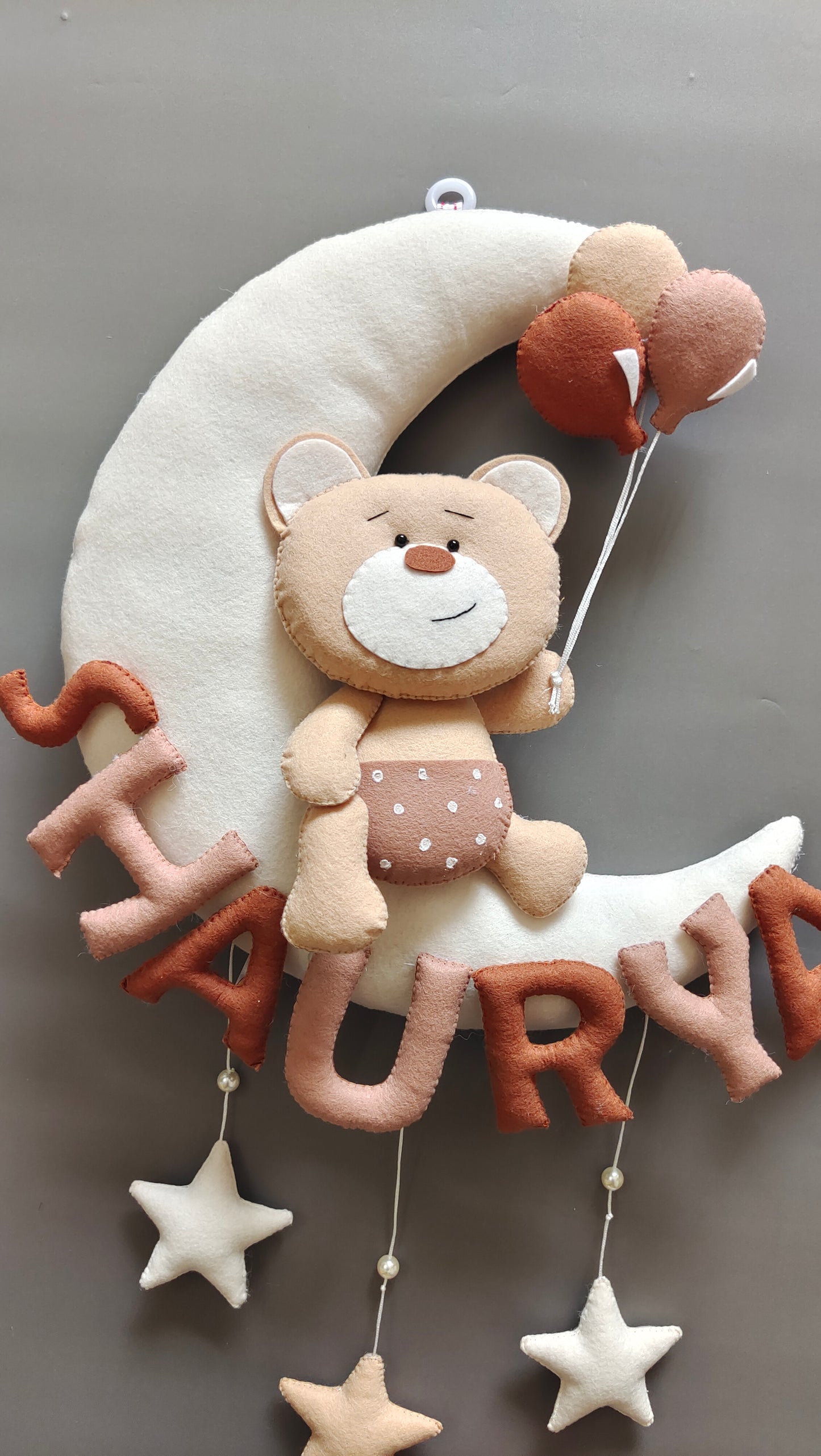Teddy on moon with balloons