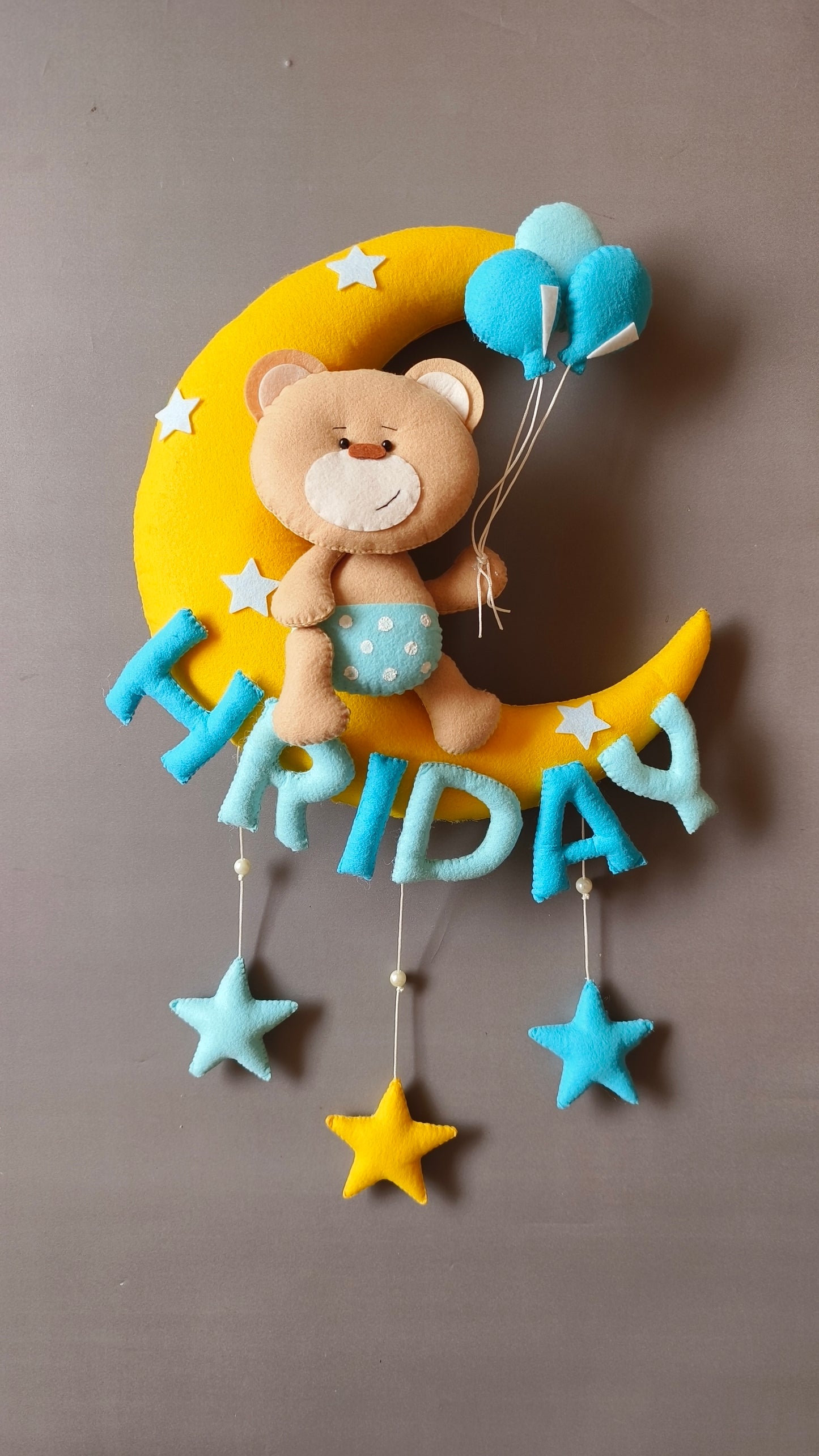 Teddy on moon with balloons