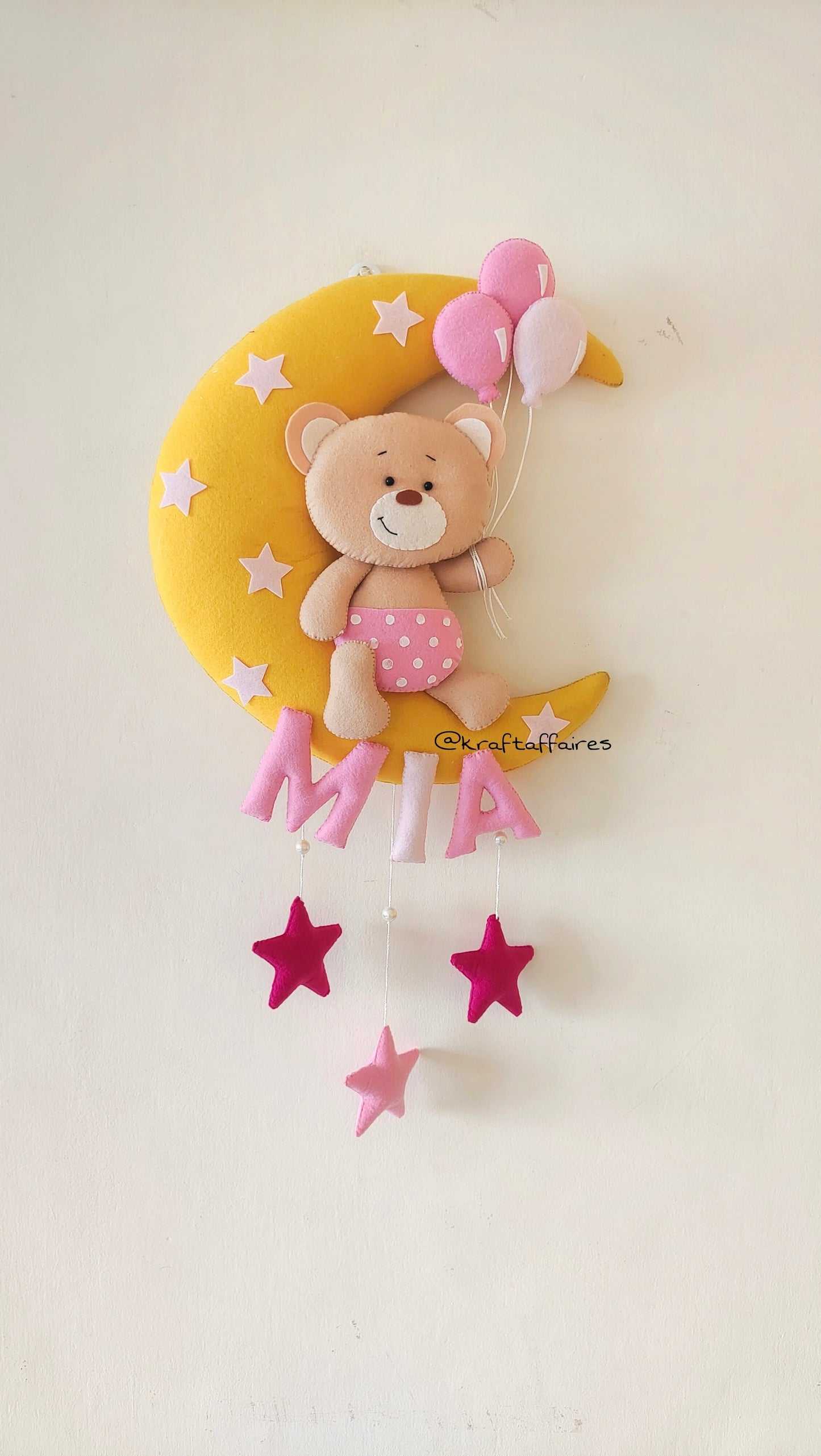 Teddy on moon with balloons