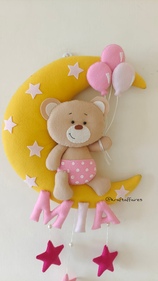 Teddy on moon with balloons