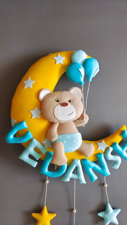 Teddy on moon with balloons