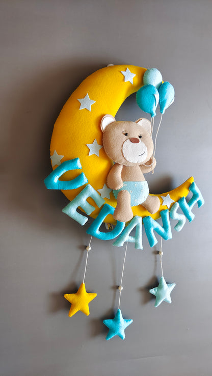 Teddy on moon with balloons