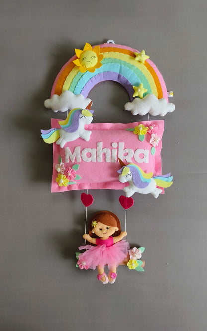 Girl on swing with unicorns