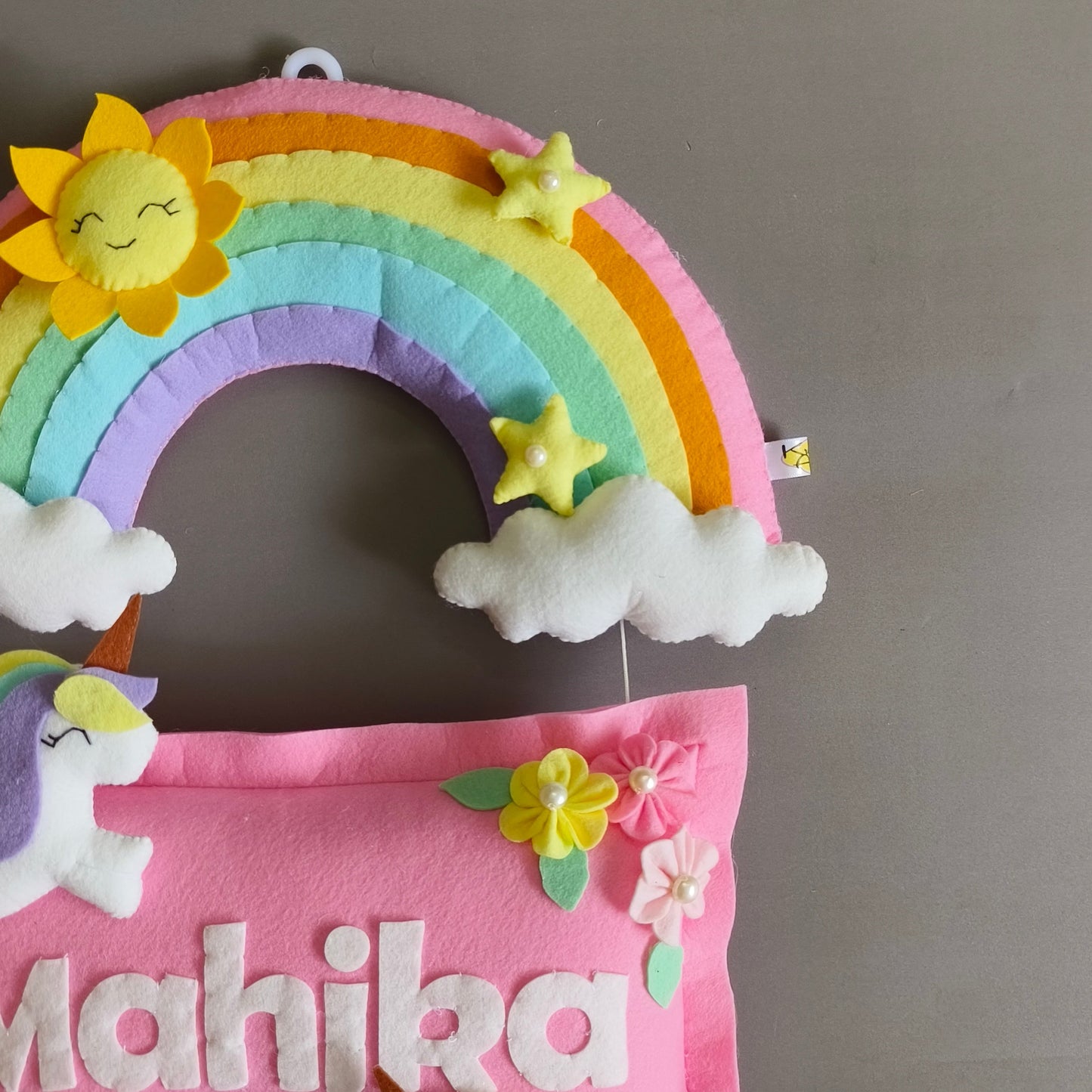 Girl on swing with unicorns