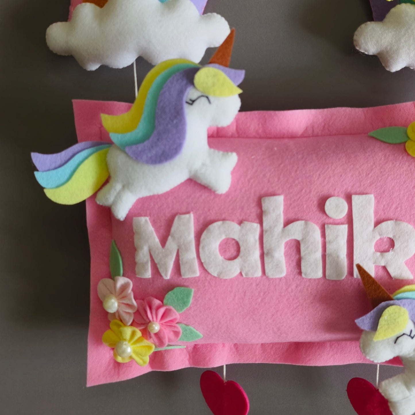 Girl on swing with unicorns