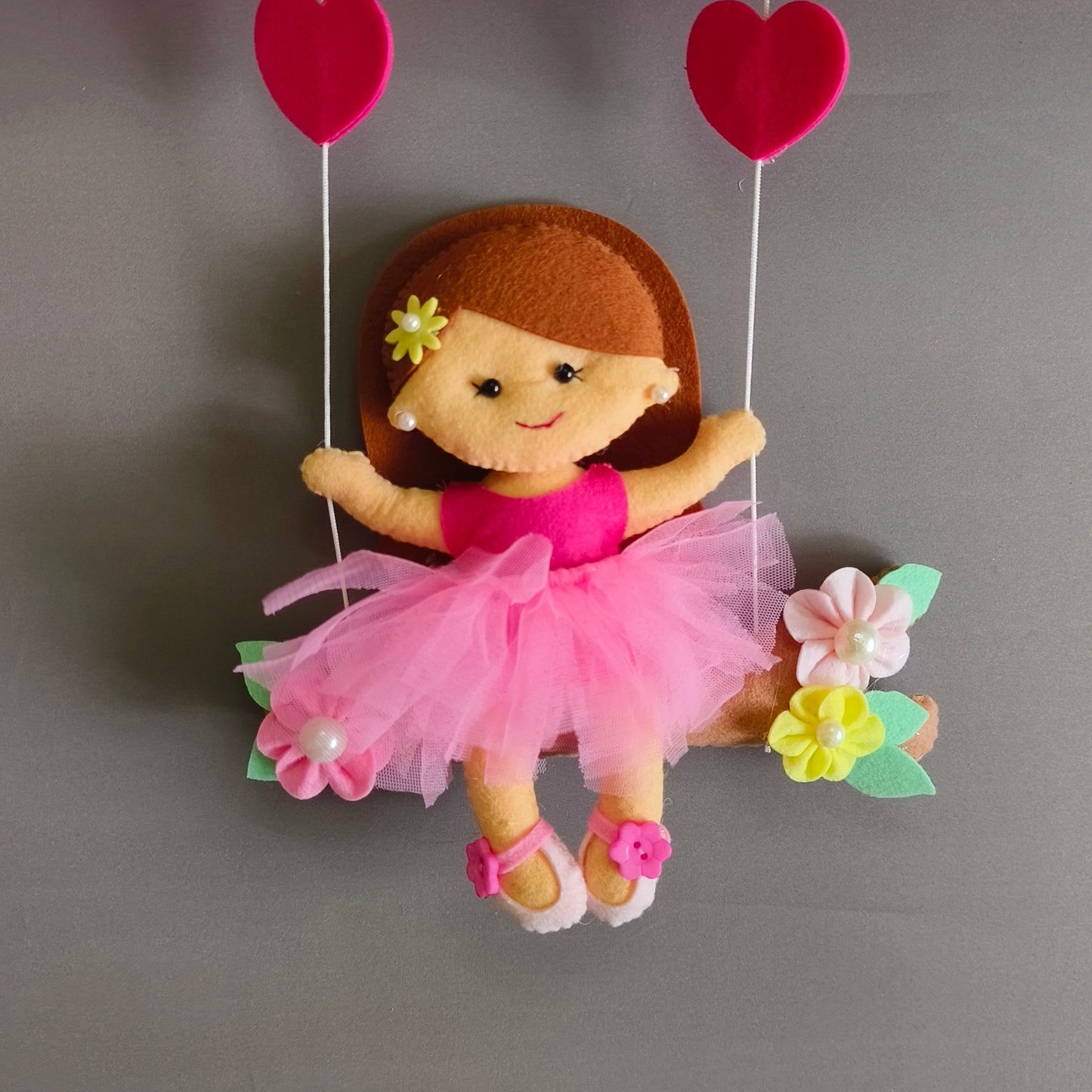 Girl on swing with unicorns