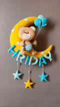 Teddy on moon with balloons