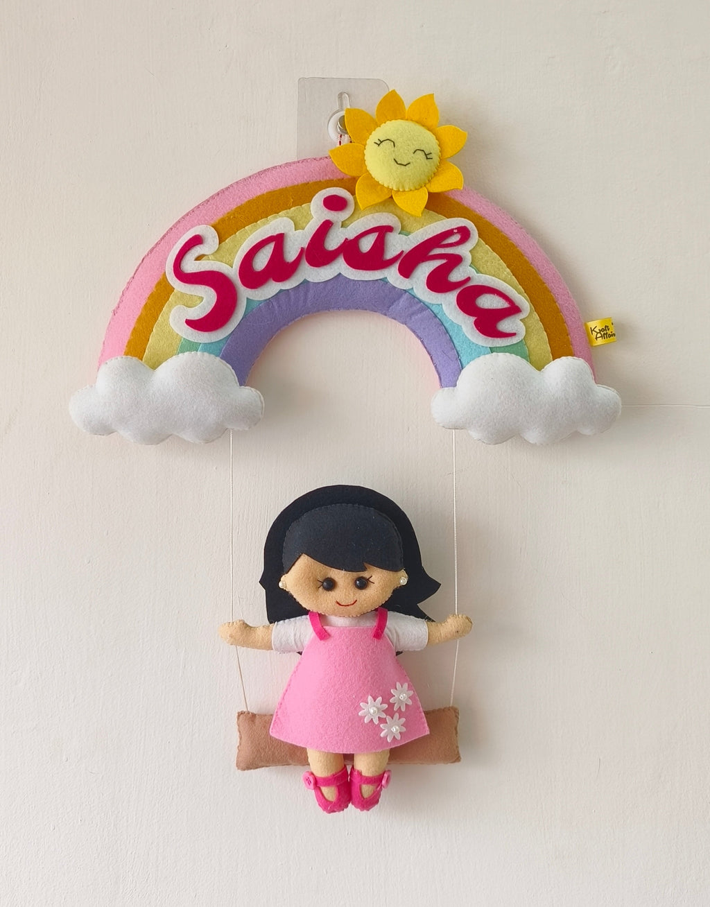 Personalised rainbow name hanging with a girl