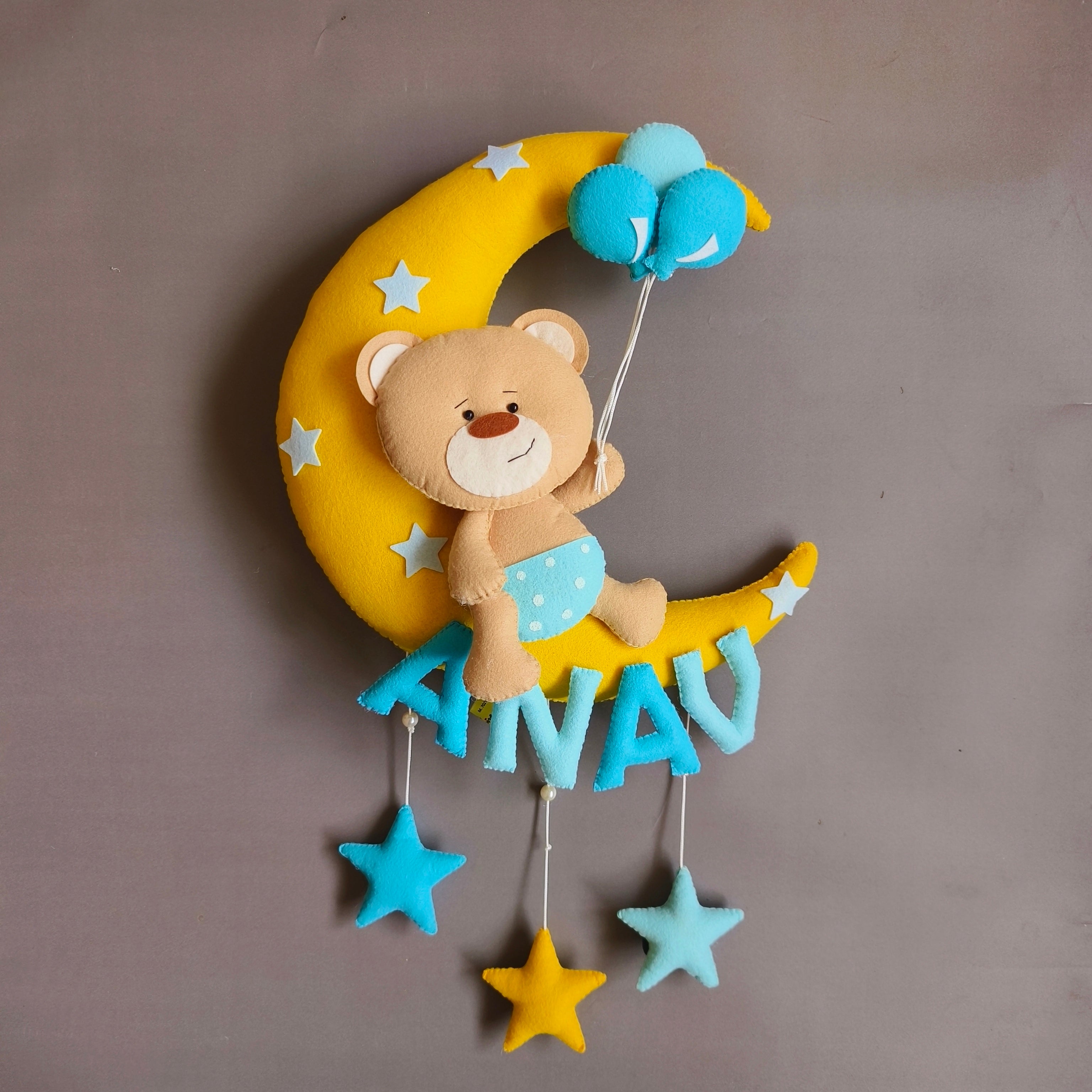 Teddy on moon with balloons