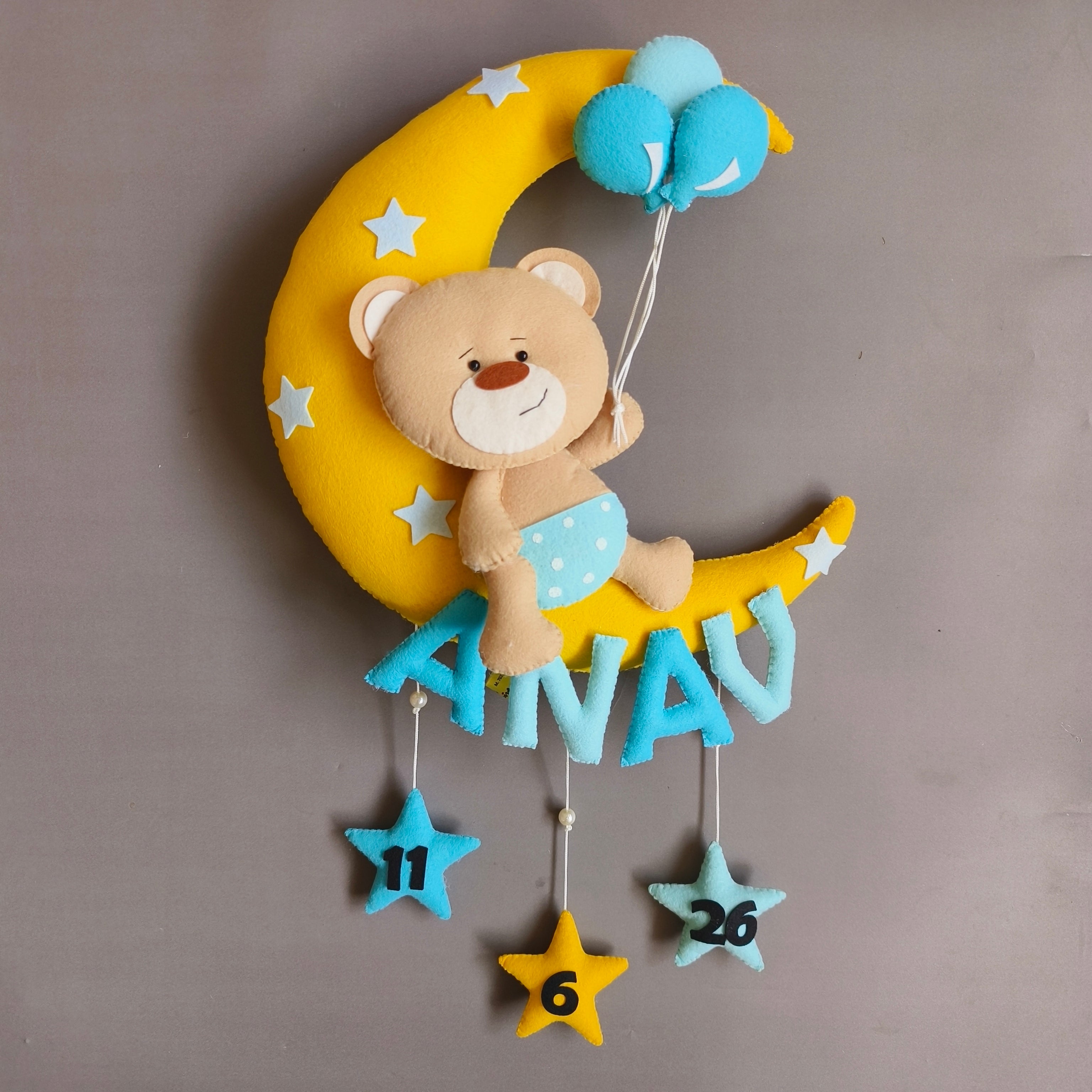 Teddy on moon with balloons