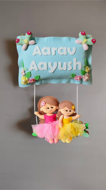 Siblings on swing